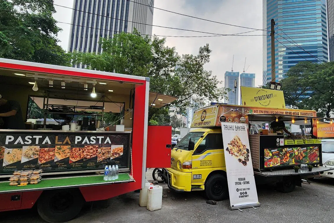 hzletter - Food trucks at one of Malaysia's biggest food truck parks,Tapak Urban Street Dining, near the Petronas Twin Towers in Kuala Lumpur.


Credit: Hazlin Hassan