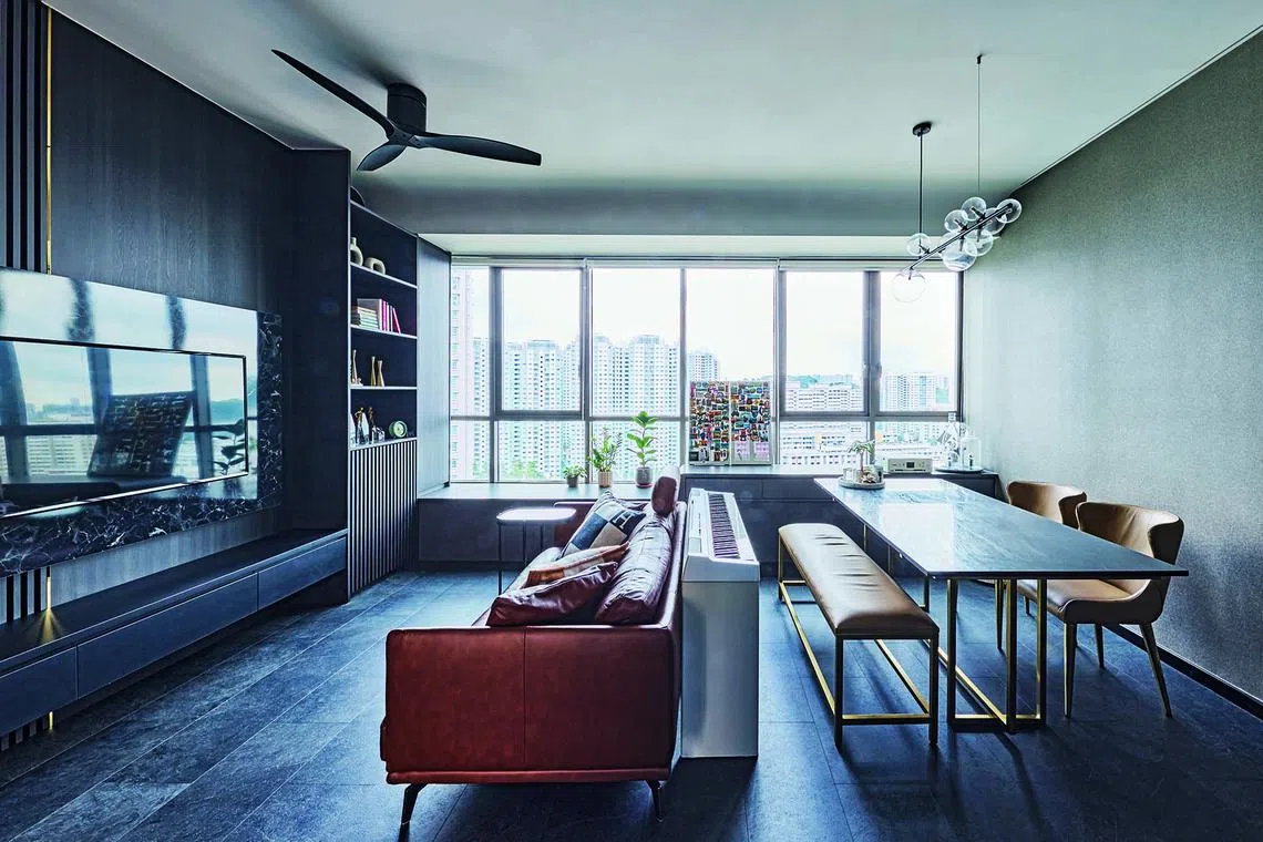 The home owner requested a dark, moody theme with luxurious vibes. In the background is the bay window, which provides additional storage while also doubling up as extra seating.