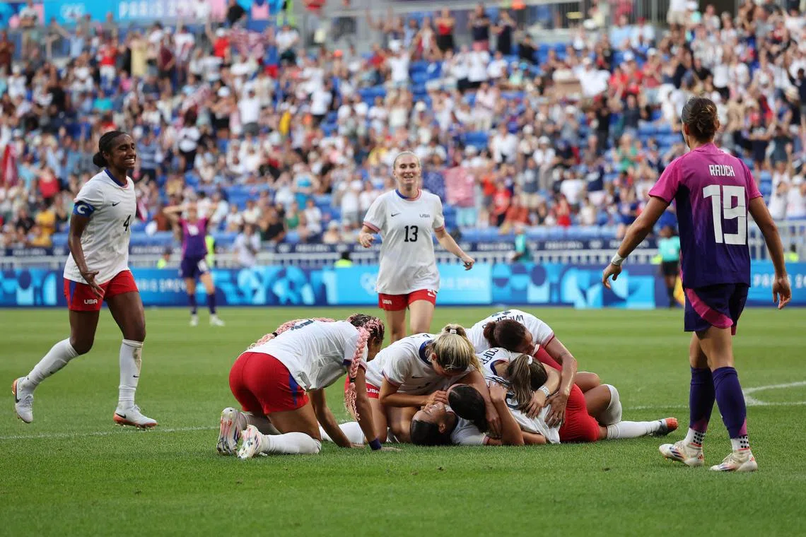 The United States celebrating after scoring against Germany in their semi-final clash at the Paris Olympics.
