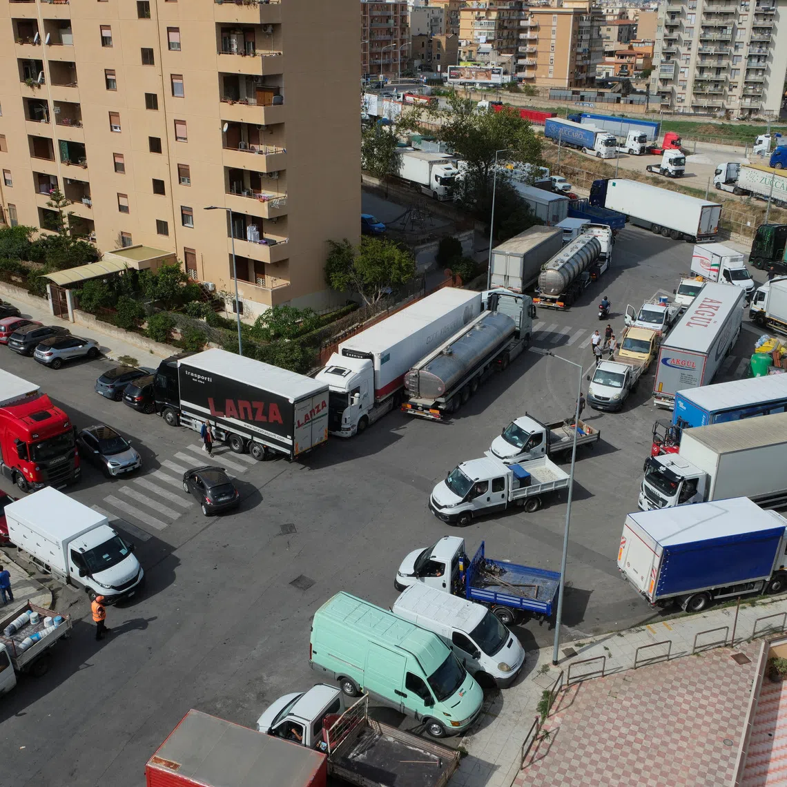 Trucks block streets in Palermo during a truckers’ protest over soaring fuel and transport costs, disrupting supply chains across Sicily and southern Italy, on Oct 20.