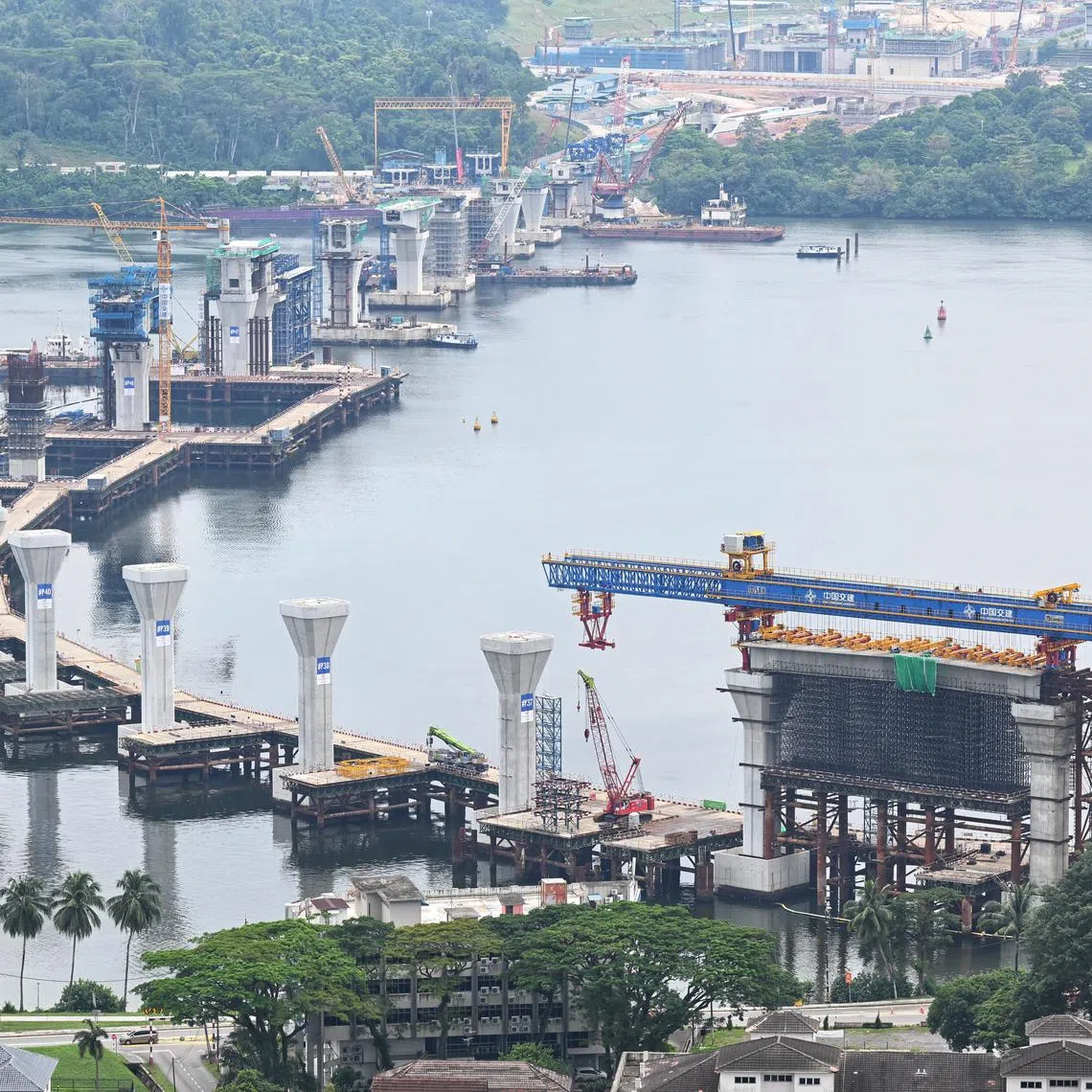 The JB-Singapore RTS link can be seen from the Paragon Suites@ CIQ condo where Justin Yeong and Niki Lee are renting in Malaysia, photographed on February 22, 2024. 

***************
SunLife feature on young couples renting and living abroad while waiting for their BTO. Unmarried couple Niki Lee and Justin Yeong are renting a 2BR condo in JB, just opposite CIQ, and commute in to Singapore almost daily.