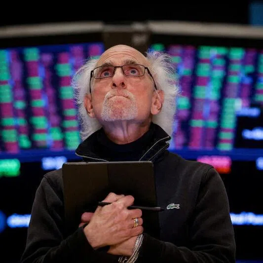 A trader works on the floor at the New York Stock Exchange in New York City.