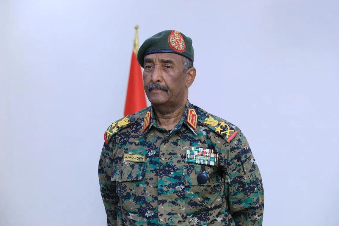 Sudan army chief, Abdel Fattah al-Burhan attends former UN official Kamil Idris swearing-in ceremony, as Sudan's new prime minister, in Port Sudan, Sudan, May 31, 2025. Sudan Transitional Sovereignty Council/Handout via REUTERS/File Photo