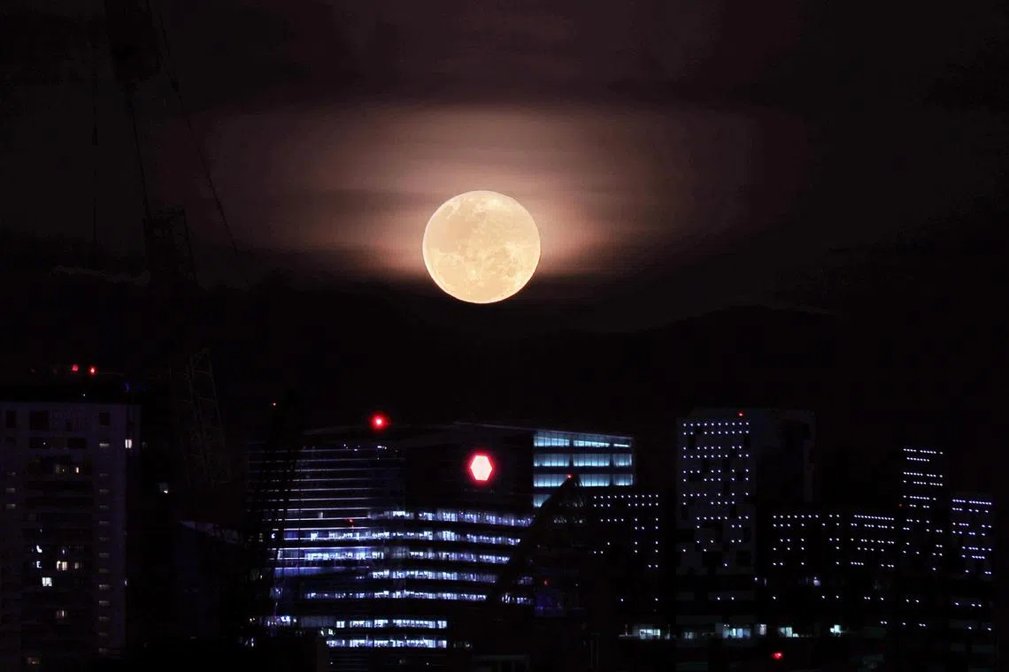 A supermoon is a full moon that orbits closest to Earth, making it appear larger and brighter than usual. 