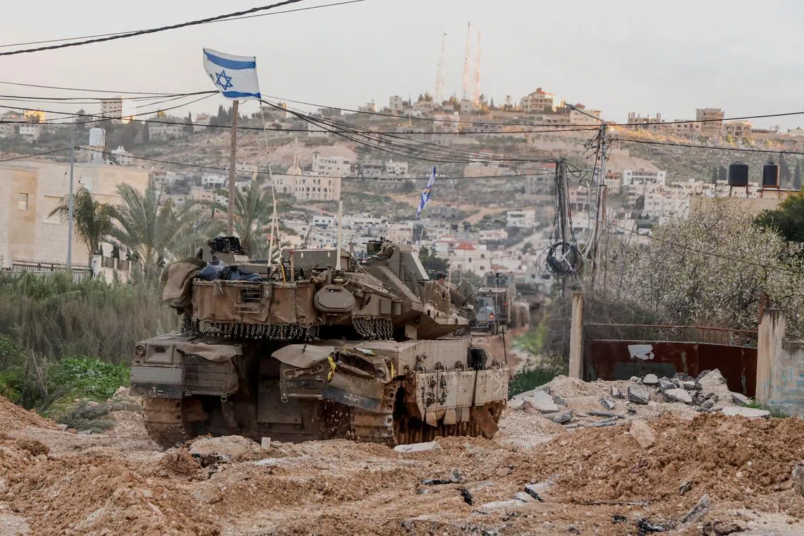 FILE PHOTO: Israeli machinery maneuvers during an Israeli operation in Jenin, in the Israeli-occupied West Bank, February 23, 2025. REUTERS/Raneen Sawafta/File Photo