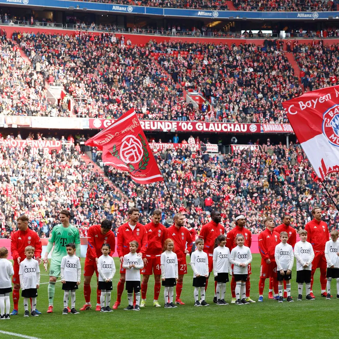 FILE PHOTO: Soccer Football - Bundesliga - Bayern Munich v 1. FC Union Berlin - Allianz Arena, Munich, Germany - March 21, 2026 Bayern Munich players line up with young mascots before the match REUTERS/Michaela Stache/ File Photo