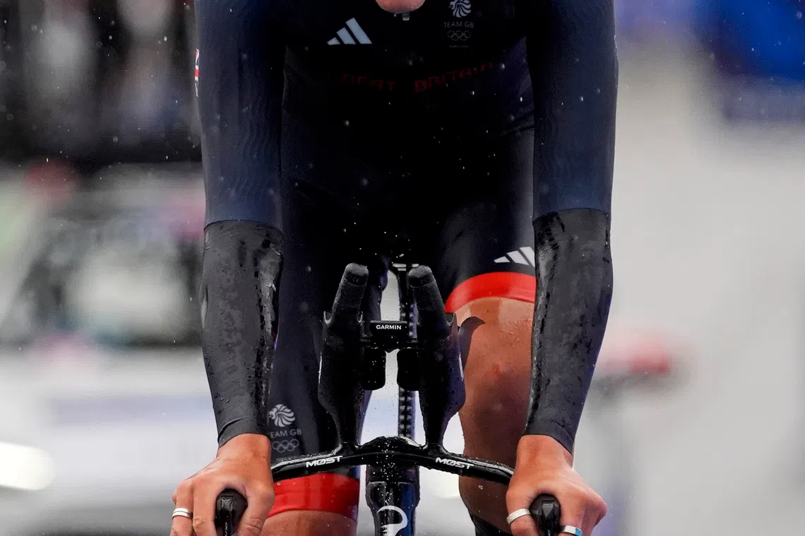 Jul 27, 2024; Paris, France; Josh Tarling (GBR) in the men’s individual time trial road cycling during the Paris 2024 Olympic Summer Games at Grand Palais-Pont Alexandre III. Mandatory Credit: Andrew P. Scott-USA TODAY Sports