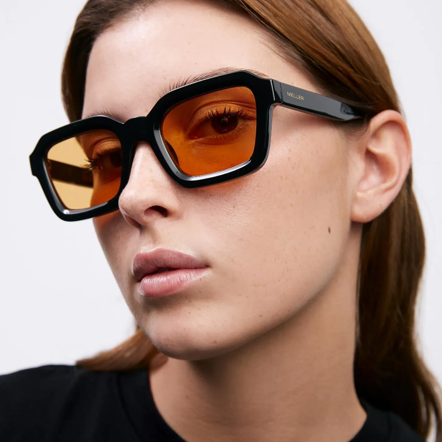 The Meller Nayah Black Orange sunglasses.