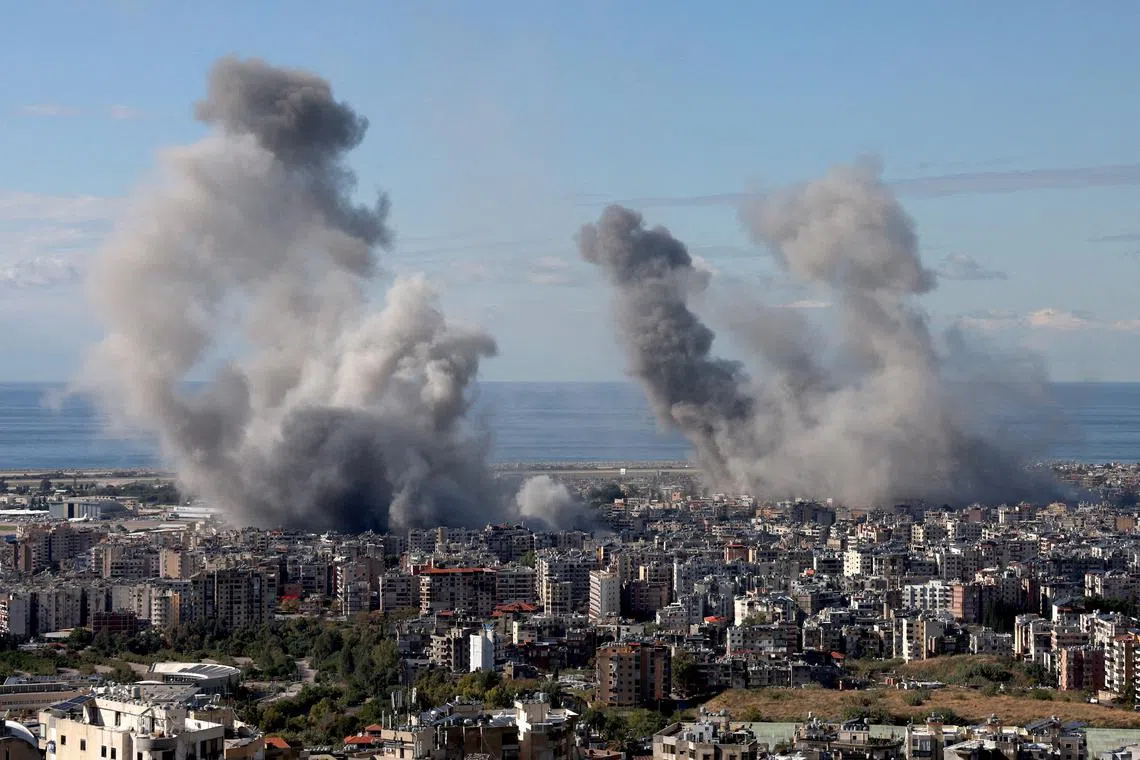 FILE PHOTO: Smoke billows over Beirut's southern suburbs, after an Israeli strike, amid the ongoing hostilities between Hezbollah and Israeli forces, as seen from Baabda, Lebanon, November 26, 2024. REUTERS/Mohamed Azakir/File Photo