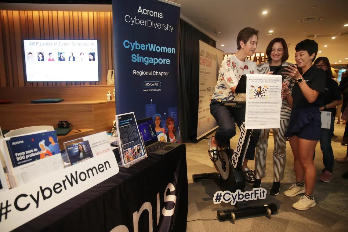 (From left) Minister for Communications and Information Josephine Teo with Acronis' senior vice-president Aliona Geckler and corporate communication assistant Chia Seok Cheng during the Ladies in Cyber Symposium. 