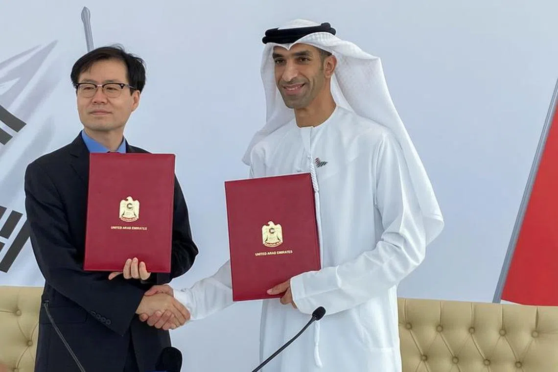 South Korean Trade Minister Yeo Han-koo and United Arab Emirates Minister of State for Foreign Trade Thani Al Zeyoudi shake hands after the announcement of the intent between the two nations to pursue a comprehensive economic partnership agreement (CEPA) in Dubai, United Arab Emirates, October 14, 2021. REUTERS/Alexander Cornwell