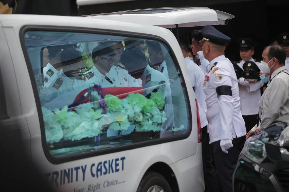 Family and friends of Sergeant Edward H Go sending the late firefighter off from Trinity Casket at Sin Ming drive for Mandai Crematorium at 12.30pm on Dec 13, 2022.