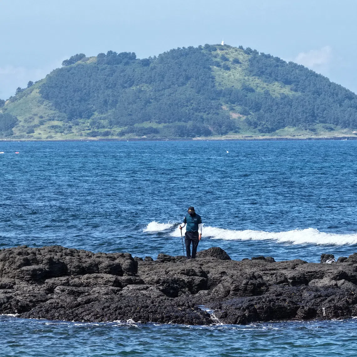 A policeman taking part in a search operation of missing person Jang Mi-ran in Jeju, South Korea, on Aug 24.