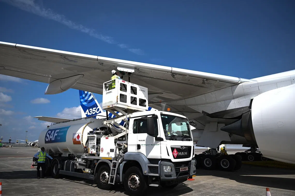 It is a delicate balance between extra costs for passengers and high costs of sustainable aviation fuel, says the writer.