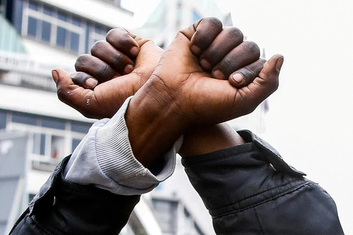 A man gestures at a demonstration over police killings of people protesting against Kenya's proposed finance bill 2024/2025, in Nairobi, Kenya, June 27, 2024. REUTERS/Monicah Mwangi