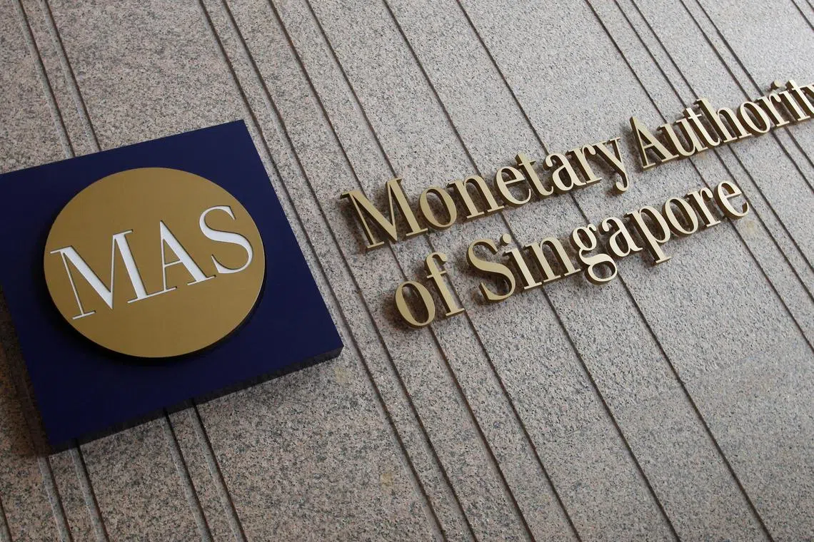 FILE PHOTO: The logo of the Monetary Authority of Singapore (MAS) is pictured at its building in Singapore February 21, 2013.  REUTERS/Edgar Su/File Photo