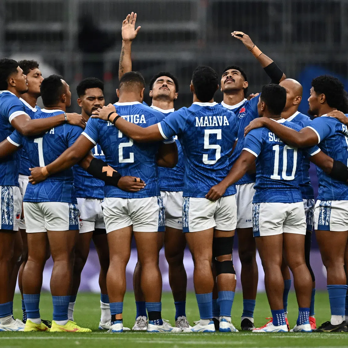 Paris 2024 Olympics - Rugby Sevens - Men's Placing 9-12 - Samoa vs Japan - Stade de France, Saint-Denis, France - July 25, 2024. Samoa players react as they huddle before the match. REUTERS/Dylan Martinez