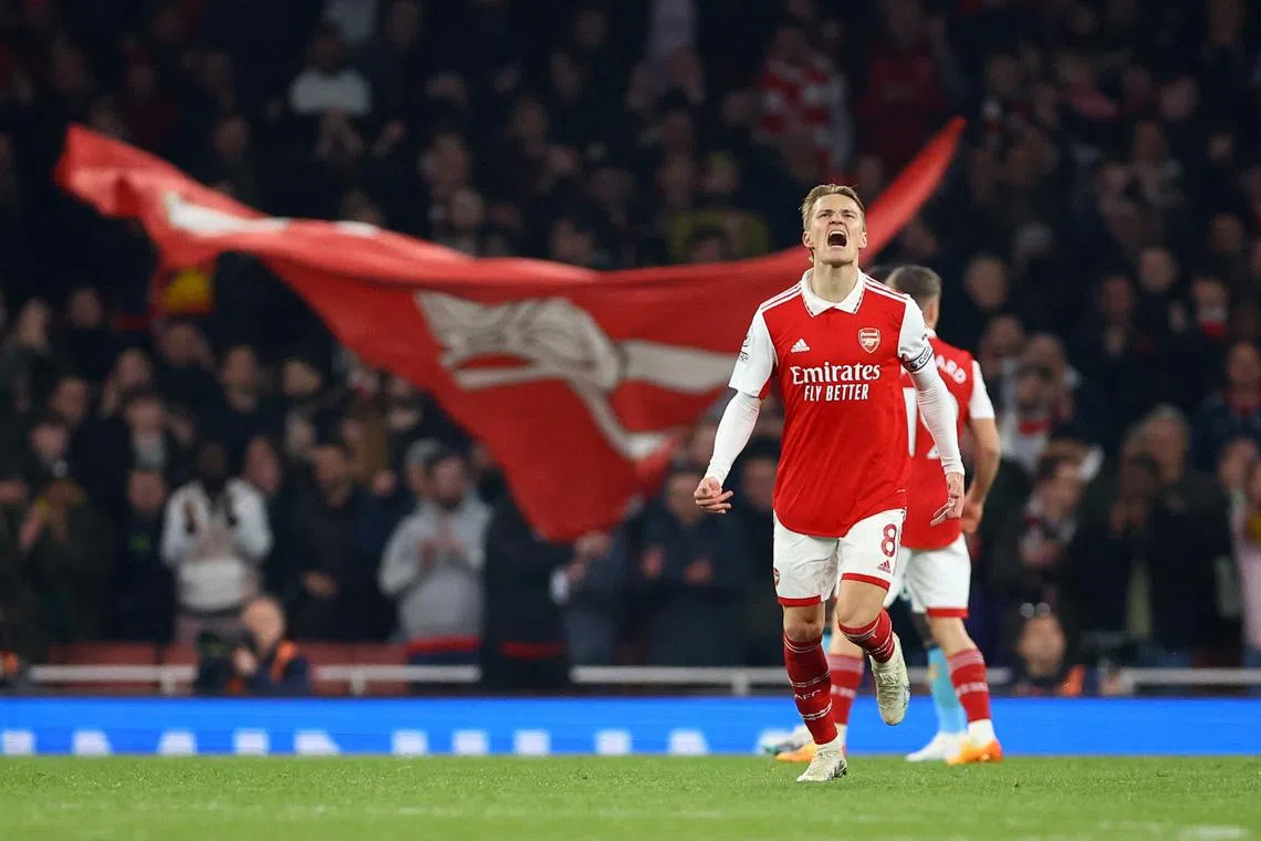 Arsenal's Martin Odegaard celebrates scoring their second goal.