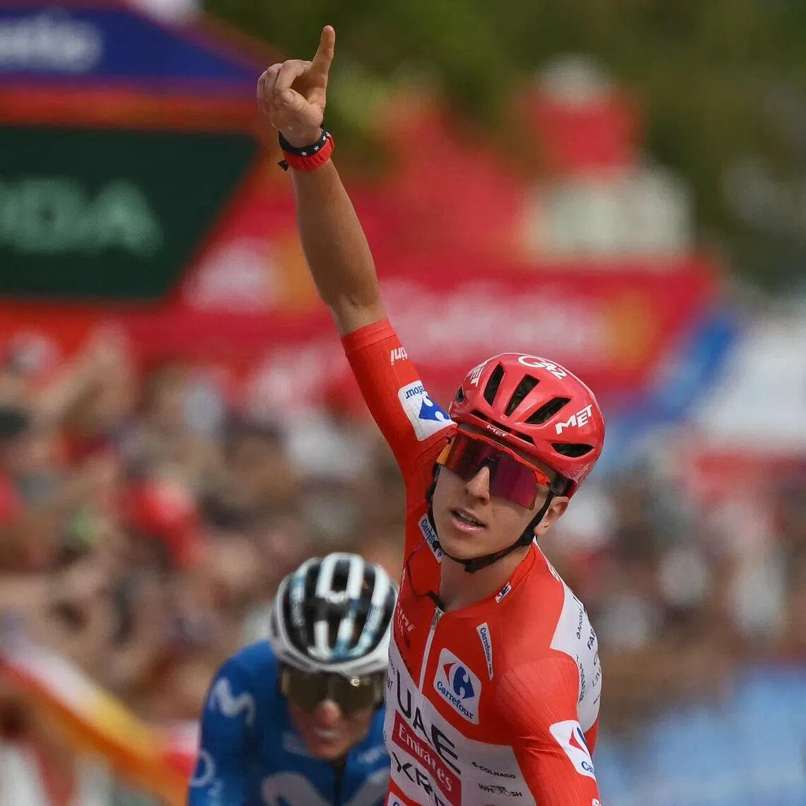 Team UAE’s Tadej Pogacar celebrates his Stage 6 win, with Team Movistar’s Enric Mas on his tail.