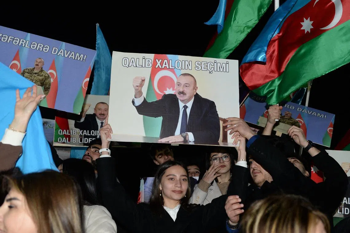 Supporters of Azerbaijani President Ilham Aliyev celebrate his anticipated success in poll results widely viewed as being a foregone conclusion.