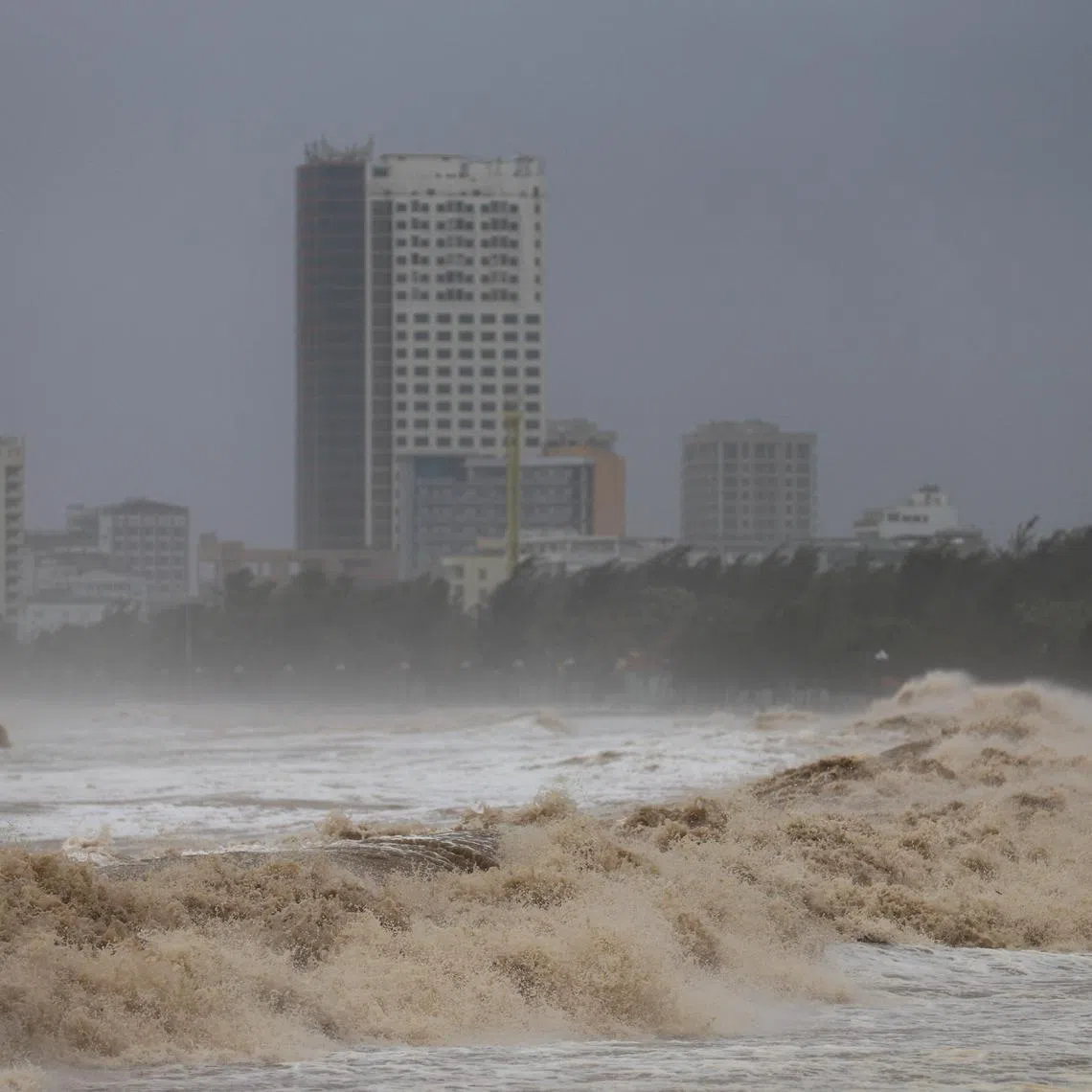 Waves approach Cua Lo beach, while Typhoon Kajiki approaches Nghe An province, Vietnam, August 25, 2025. 