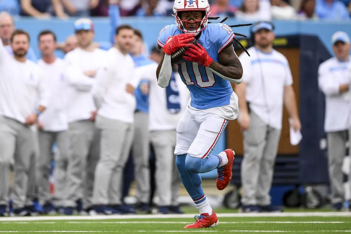 FILE PHOTO: Oct 29, 2023; Nashville, Tennessee, USA;  Tennessee Titans wide receiver DeAndre Hopkins (10) makes a touchdown catch against the Atlanta Falcons during the second half at Nissan Stadium. Mandatory Credit: Steve Roberts-USA TODAY Sports/File Photo