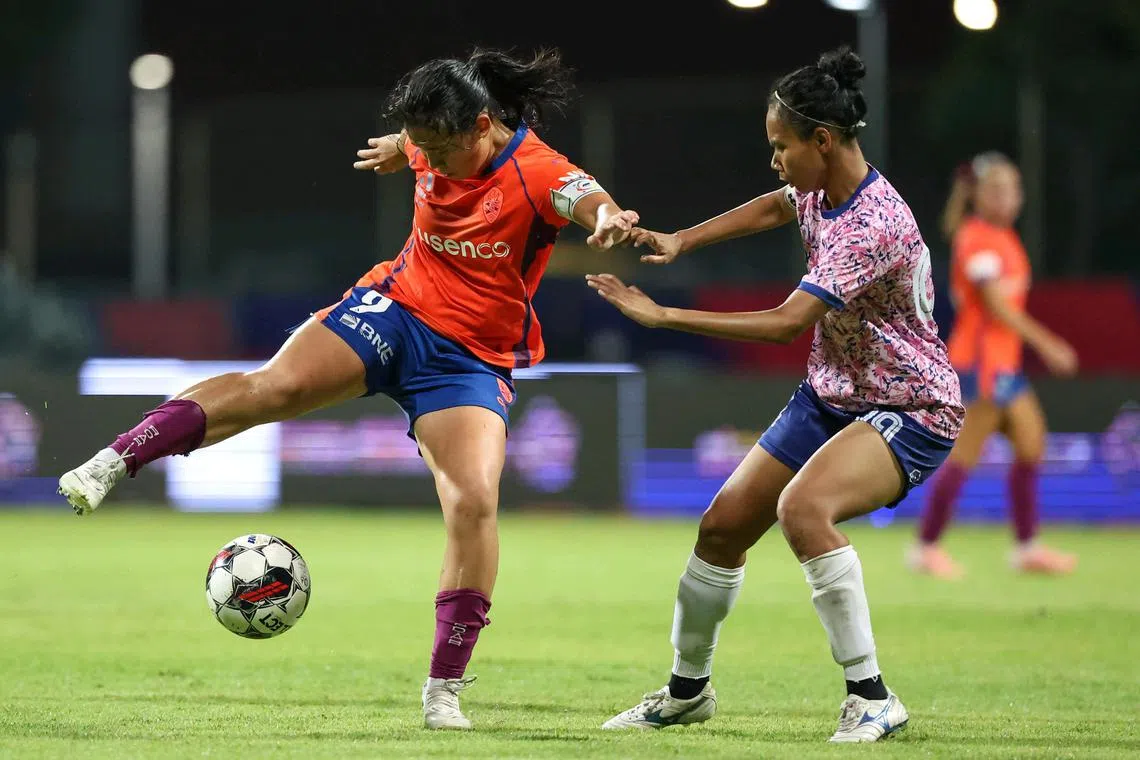 Brisbane Roar's Danelle Tan (left) fighting for the ball against the Women's Premier League All-Star team captain Siti Rosnani Azman at an exhibition match on April 4, 2025.