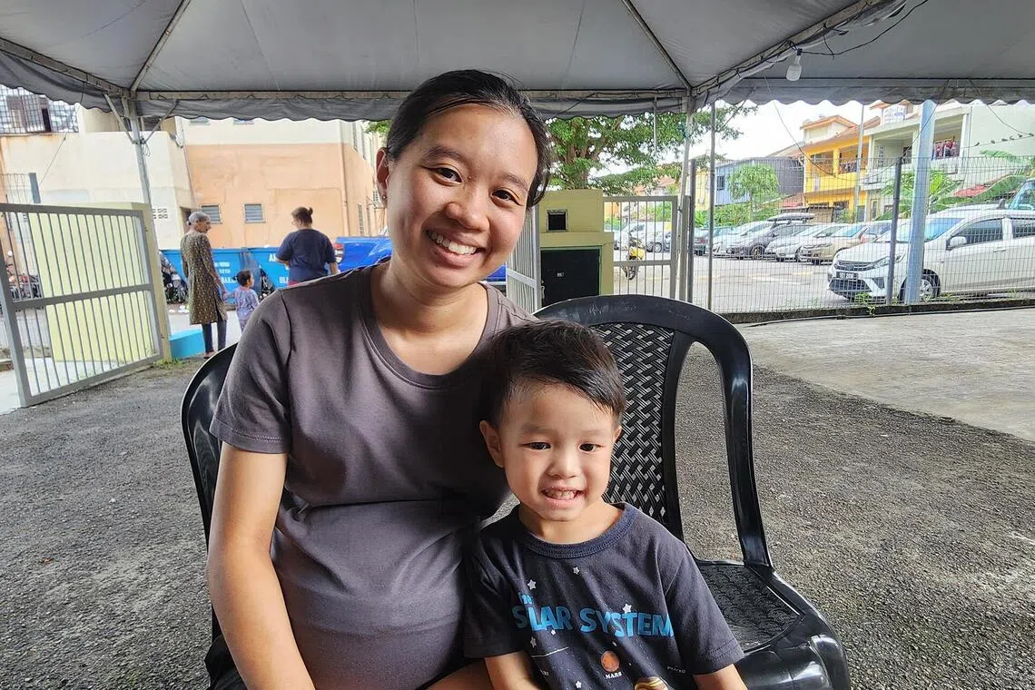 Housewife Carmen Law, 31, with her son who has been receiving nutritional support and monitoring through a community programme in Puchong, Selangor.