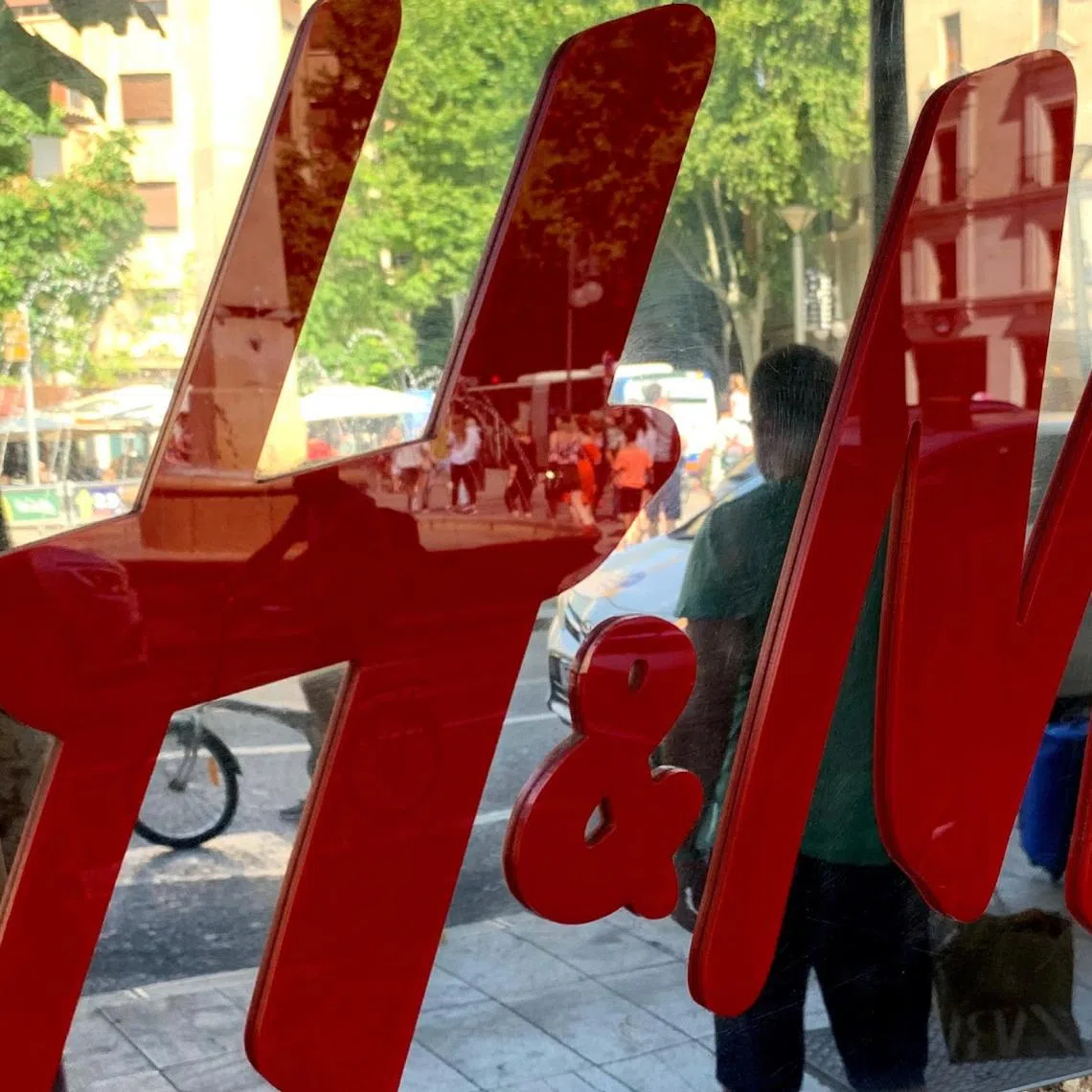 An H&M sign is seen at the entrance to an H&M store in Palma on the island of Mallorca, Spain June 14, 2019. Picture taken June 14, 2019.