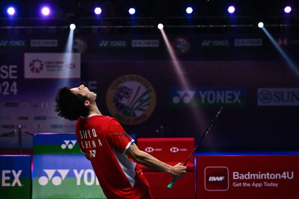 China's Shi Yuqi celebrating after beating Hong Kong's Lee Cheuk Yiu 23-21, 21-17 in the men's singles final of the India Open badminton tournament held at Indira Gandhi Stadium on Jan 21.
