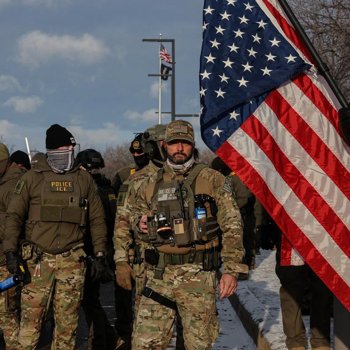 U.S. Immigration and Customs Enforcement (ICE) agents stand guard outside the Bishop Henry Whipple Federal Building during a demonstration against increased immigration enforcement, days after a U.S. Immigration and Customs Enforcement (ICE) agent fatally shot Renee Nicole Good, in Minneapolis, Minnesota, U.S., January 10, 2026. REUTERS/Tyrone Siu