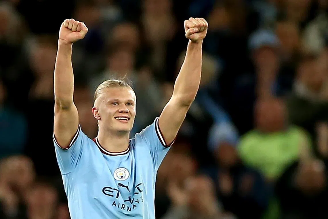 Erling Haaland celebrates after scoring Manchester City's second goal.