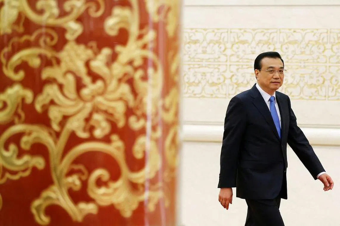FILE PHOTO: China's Premier Li Keqiang arrives for a news conference after the closing ceremony of China's National People's Congress (NPC) at the Great Hall of the People in Beijing, China, March 15, 2017. REUTERS/Damir Sagolj/File Photo