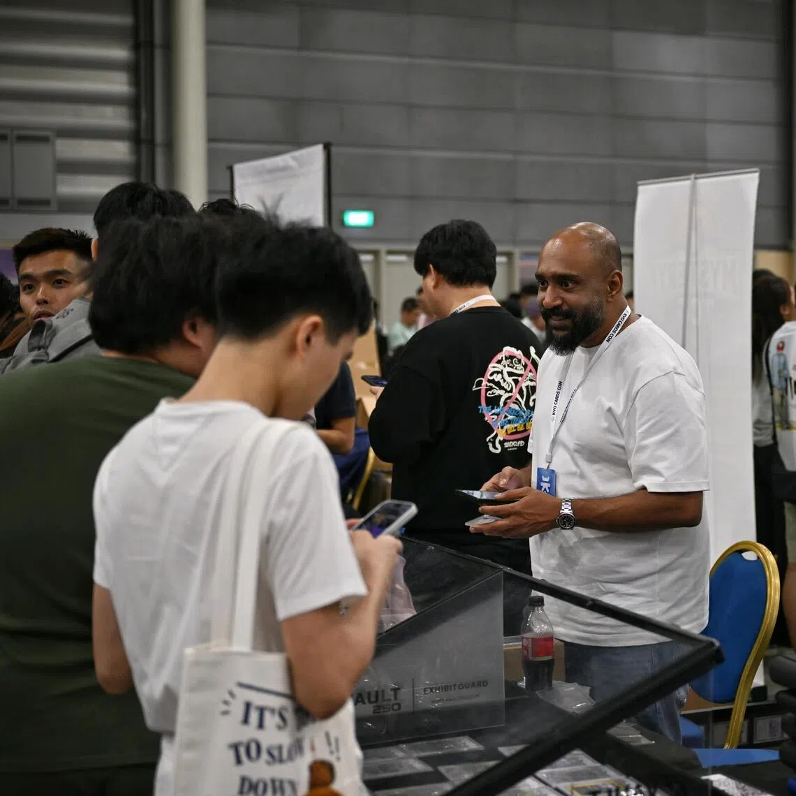 A chance encounter with Singapore collectors in Dubai brought Mr Sony Rehan (centre) to Singapore's fast-growing trading card scene.