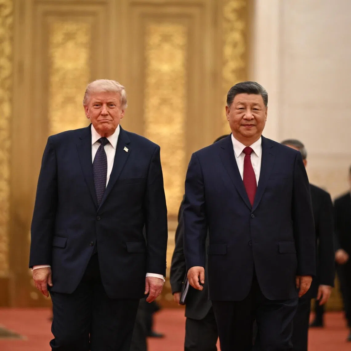 US President Donald Trump (left) and Chinese President Xi Jinping arriving for a state banquet at the Great Hall of the People in Beijing on May 14.