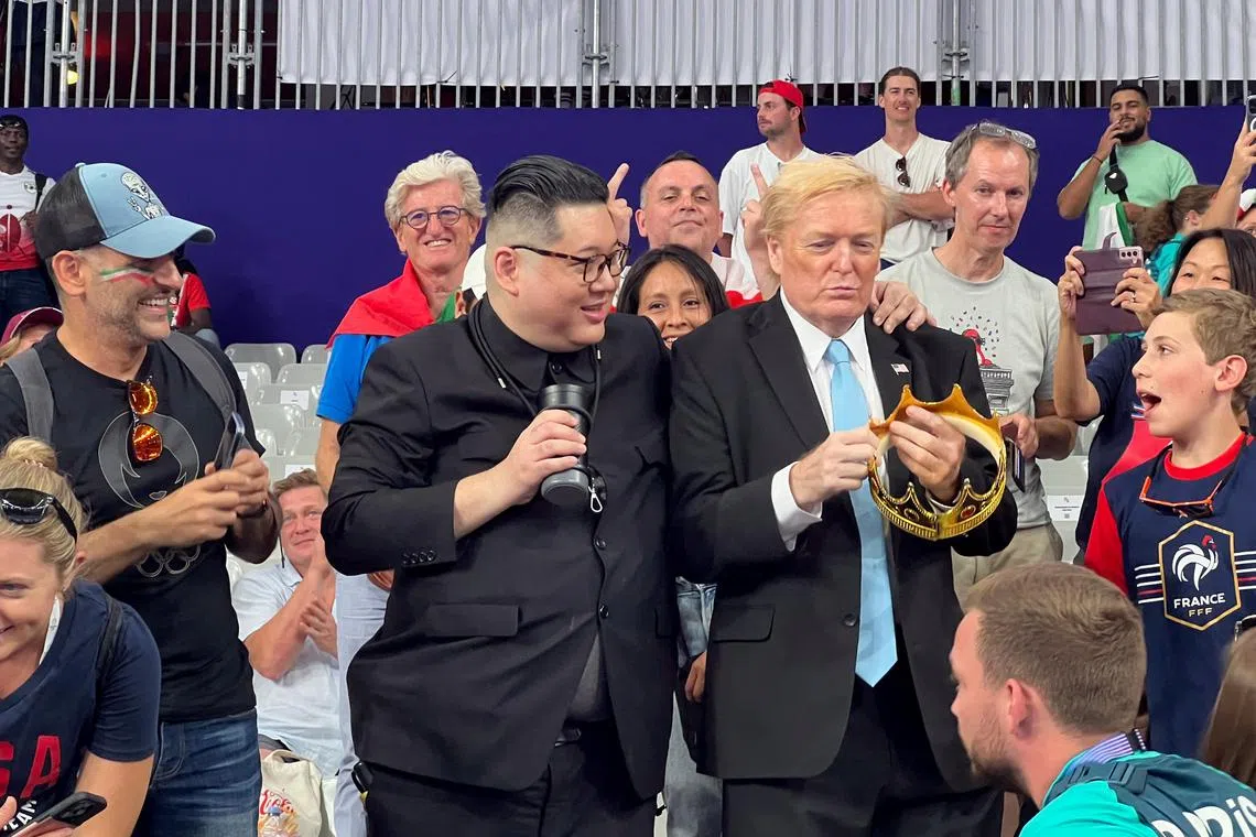 Impersonators of North Korean leader Kim Jong Un and former US president Donald Trump in the stands during the women's 4x400m relay final at the Paris Olympics on Aug 10.