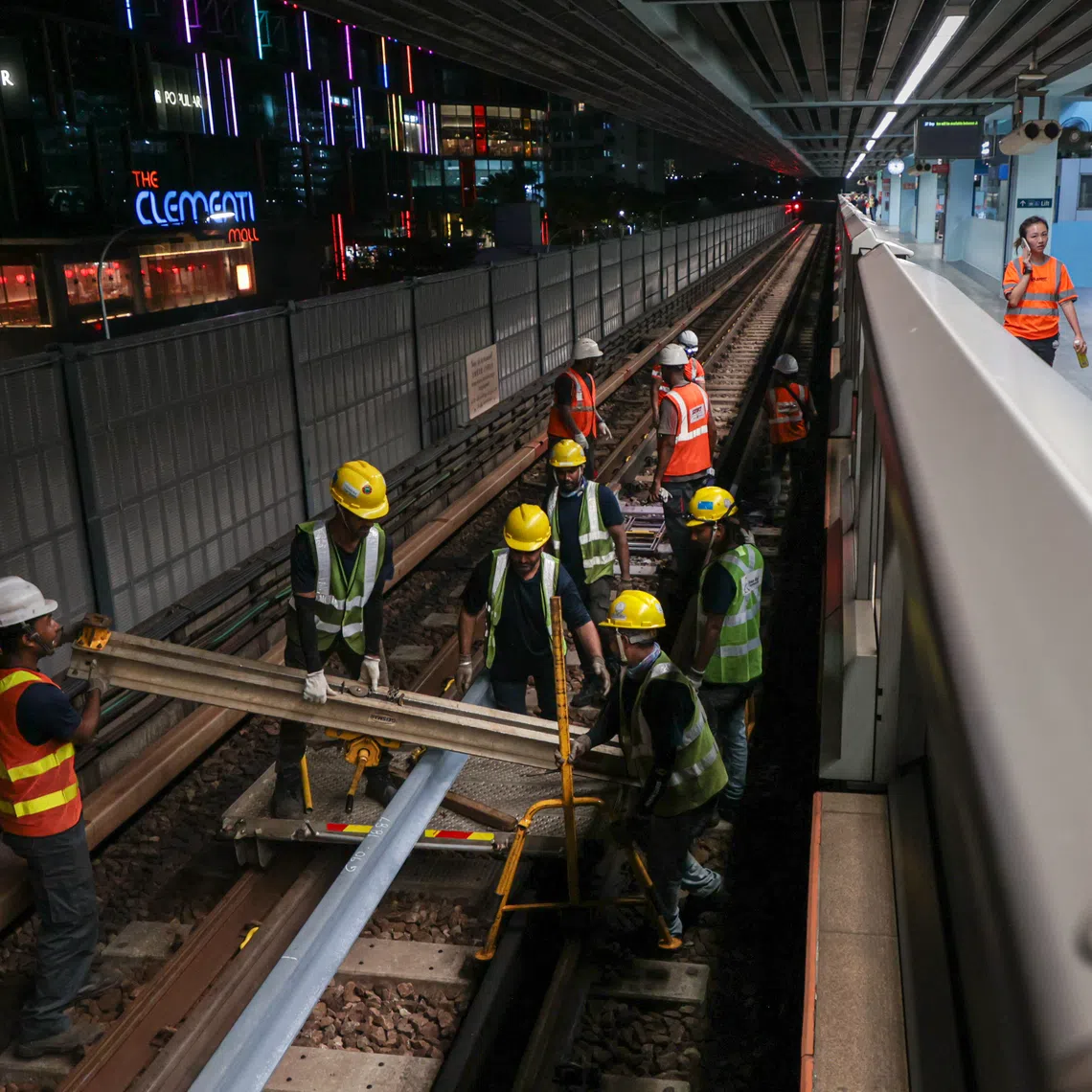 Technicians performing repairs at Clementi MRT station on Sept 27, 2024, after an axle bearing failure caused a six-day disruption on the East-West Line.