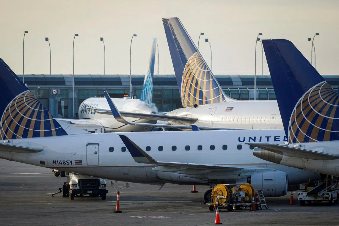 FILE PHOTO: United Airlines planes are parked at their gates at O'Hare International Airport ahead of the Thanksgiving holiday in Chicago, Illinois, U.S., November 20, 2021.  REUTERS/Brendan McDermid/File Photo
