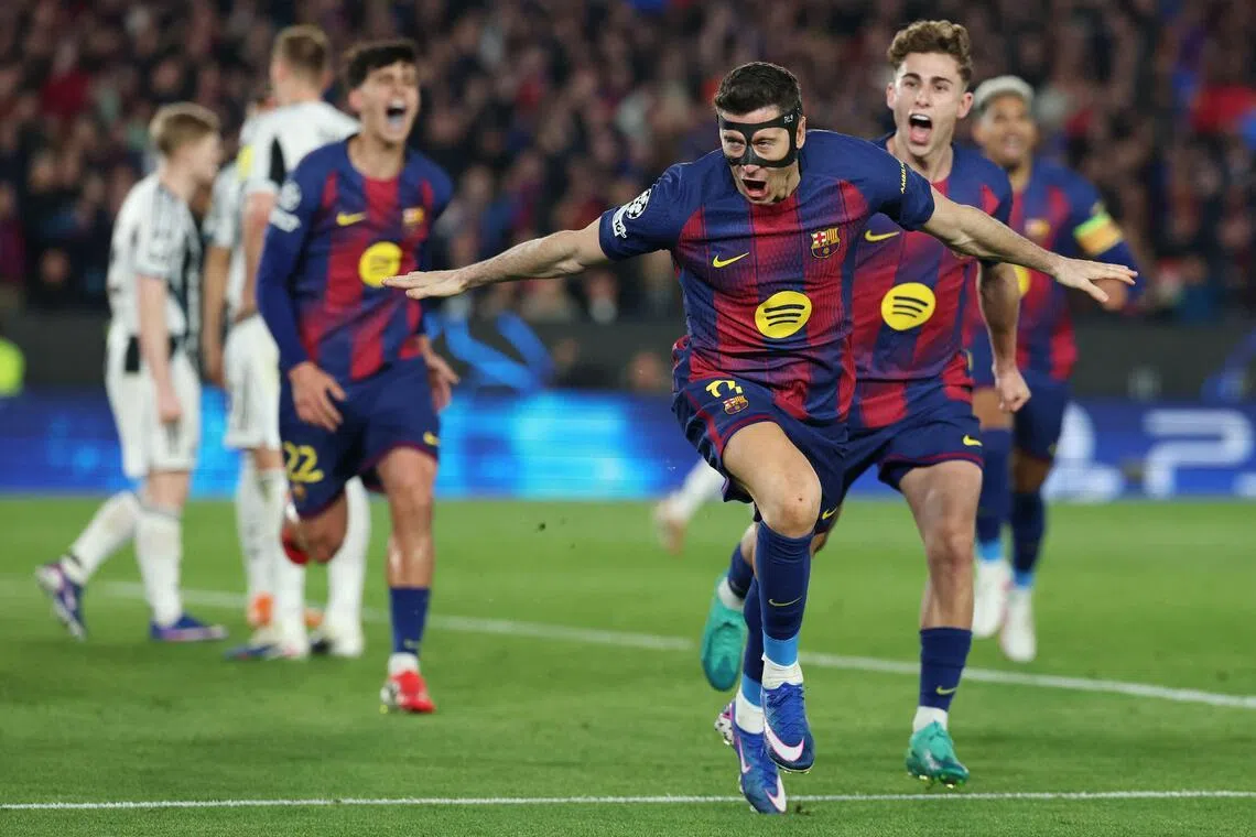 Barcelona's Robert Lewandowski celebrates scoring his team's fifth goal against Newcastle United on March 18.