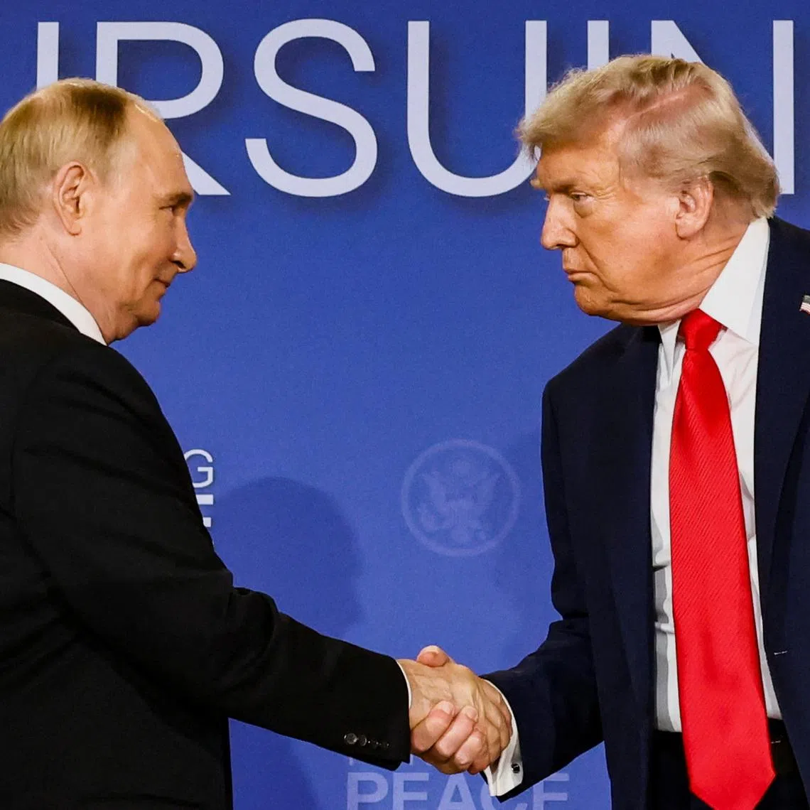 U.S. President Donald Trump and Russian President Vladimir Putin shake hands during a press conference following their meeting to negotiate an end to the war in Ukraine, at Joint Base Elmendorf-Richardson, in Anchorage, Alaska, U.S., August 15, 2025. REUTERS/Kevin Lamarque/File Photo