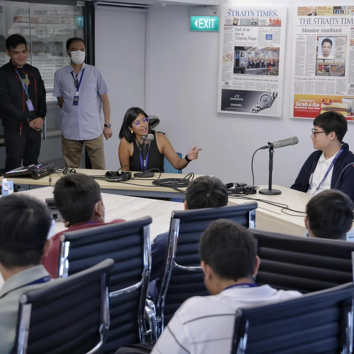 Correspondent and host of The Usual Place podcast Natasha Zachariah giving Gregory Ng (second form right), 15, Secondary 3 student from Raffles Institution, and Fayth Wai (right), 14, Secondary 2 student from Fairfield Methodist Secondary School, a hands on experience in podcasting during The Straits Times’ journalism programme for youths in SPH Media on June 4, 2024. ST's journalism programme for youths is a part of our outreach efforts to the community.