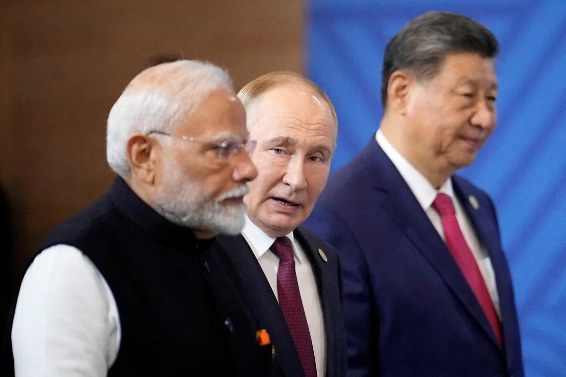 FILE PHOTO: Indian Prime Minister Narendra Modi, Russian President Vladimir Putin and Chinese President Xi Jinping attend a family photo ceremony prior to the BRICS Summit plenary session in Kazan, Russia, Wednesday, Oct. 23, 2024.     Alexander Zemlianichenko/Pool via REUTERS/File Photo