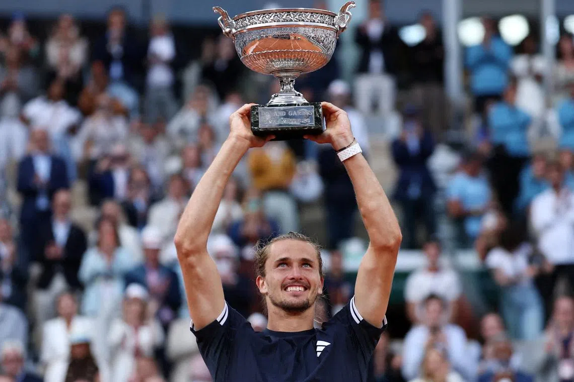 Tennis - French Open - Roland Garros, Paris, France - June 7, 2026 Germany's Alexander Zverev celebrates with the trophy after winning the final against Italy's Flavio Cobolli REUTERS/Stephane Mahe