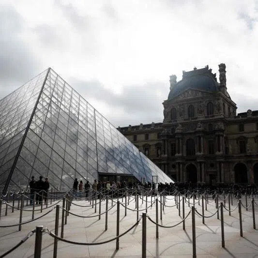 Tourists queue to enter the Louvre museum in Paris, France, on Nov 3.