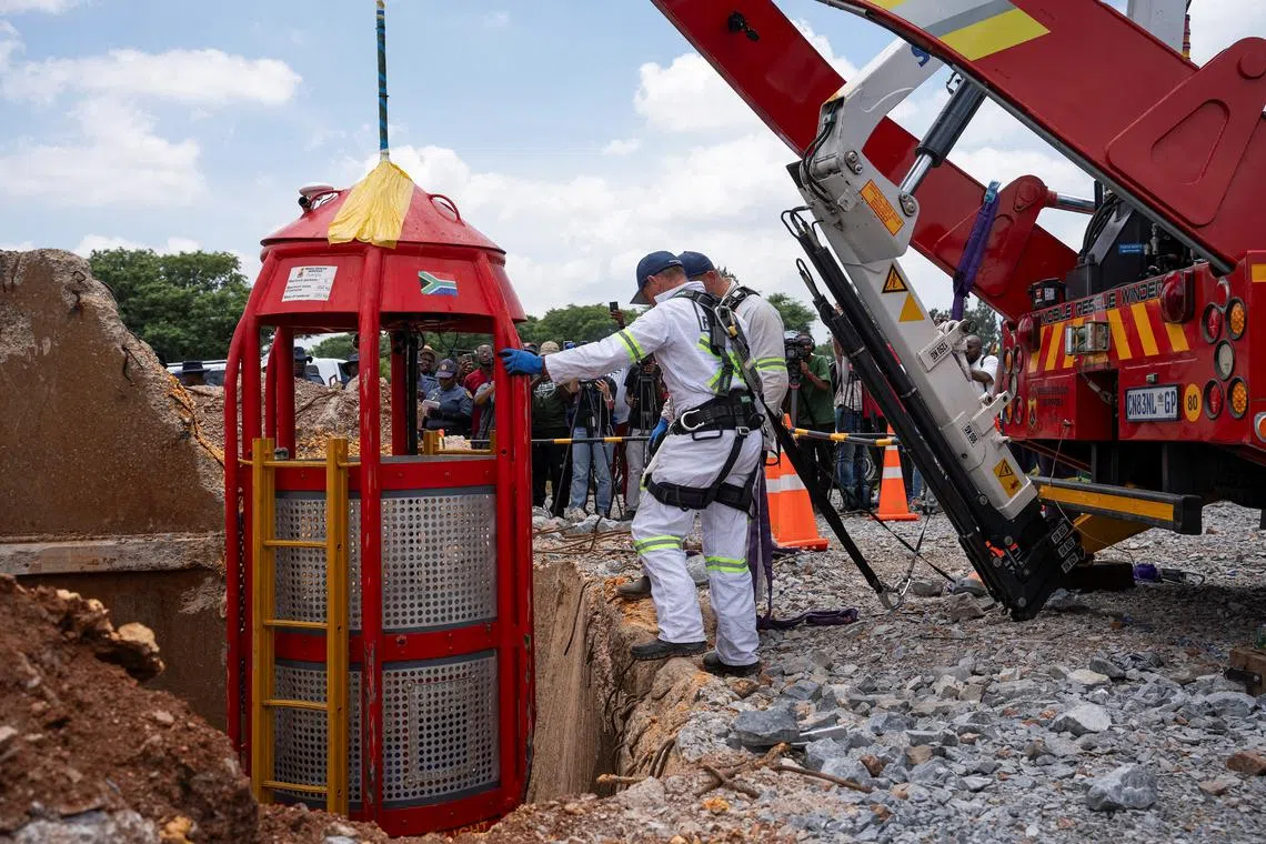 Workers from Mines Rescue Services operate the mechanical cage that was used for rescue operations at the mine shaft, where rescue operations are now completed, as authorities say that no miners remain below ground after attempts were made to rescue illegal miners who have been underground for months, in Stilfontein, South Africa, January 16, 2025. REUTERS/Ihsaan Haffejee