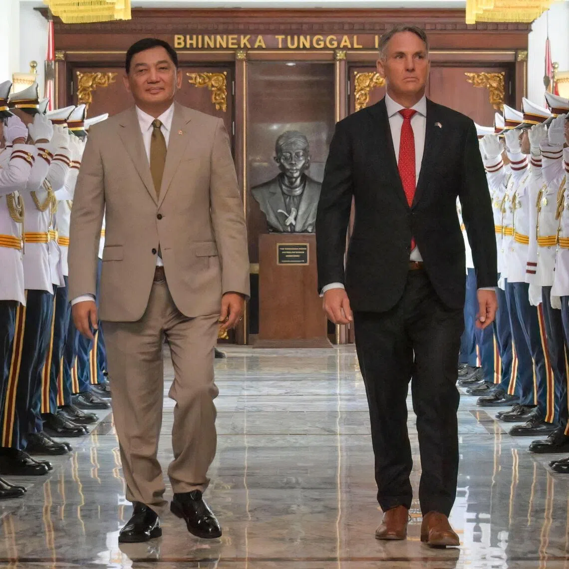 Australia's Defence Minister Richard Marles (R) walks with his Indonesian counterpart, Mr Sjafrie Sjamsoeddin, after their meeting at the defence ministry in Jakarta on March 12, 2026. 