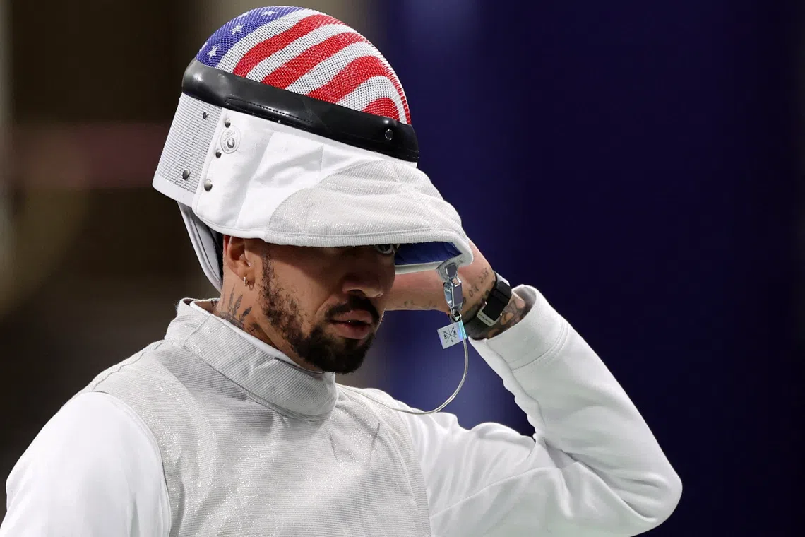 Paris 2024 Olympics - Fencing - Men's Foil Team Semifinals - Grand Palais, Paris, France - August 04, 2024. Miles Chamley-Watson of United States against Tommaso Marini of Italy. REUTERS/Maye-E Wong