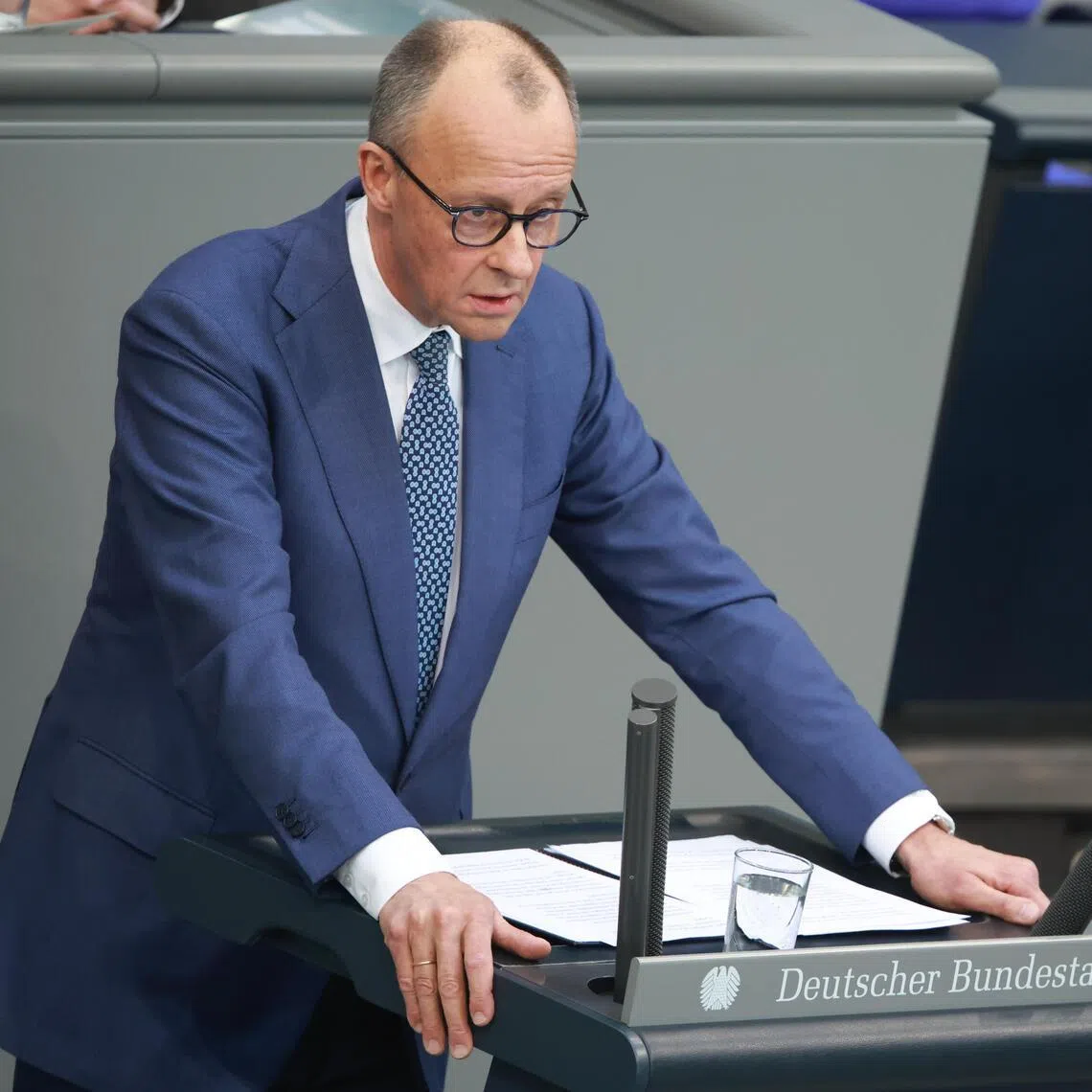 German Chancellor Friedrich Merz delivering a speech on March 18 at the German Parliament building in Berlin.