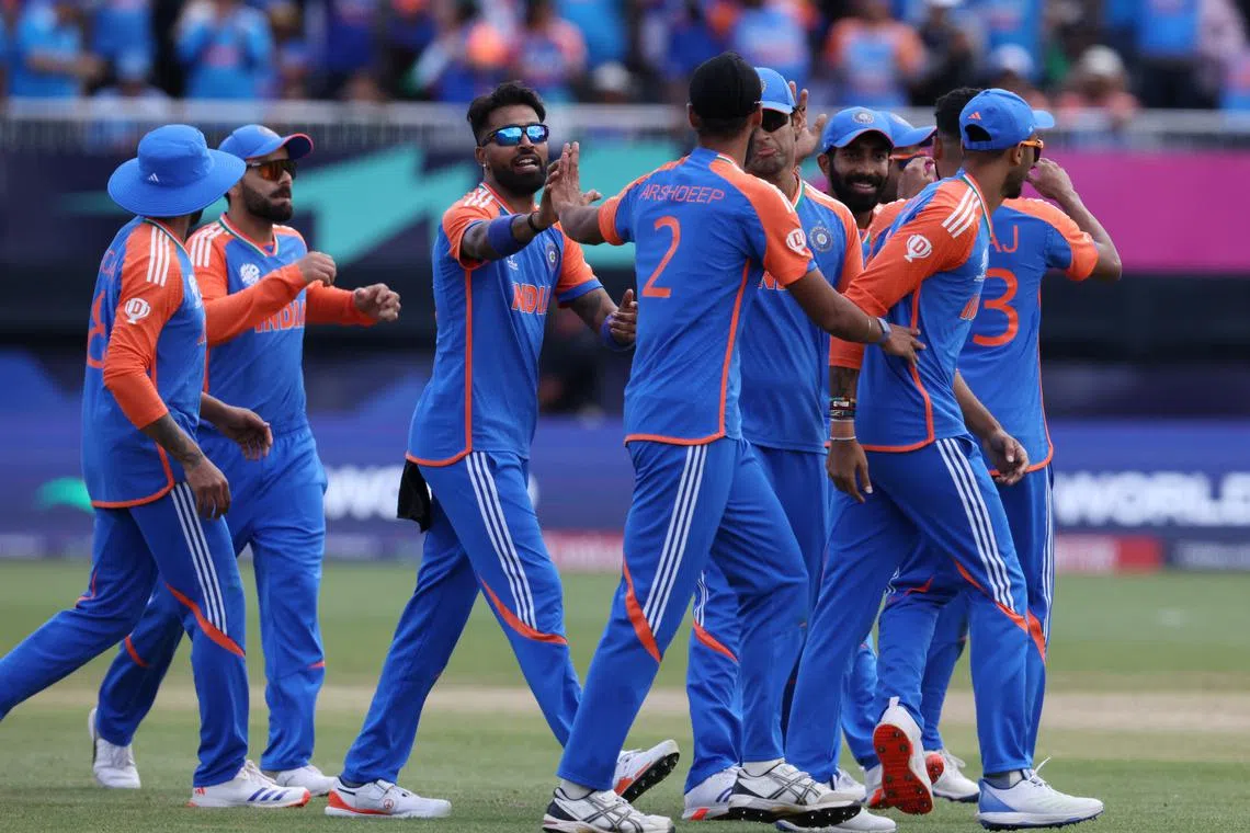 FILE PHOTO: Cricket - ICC T20 World Cup 2024 - Group A - India v Pakistan - Nassau County International Cricket Stadium, New York, United States - June 9, 2024 India's Arshdeep Singh celebrates the wicket of Pakistan's Imad Wasim with teammates REUTERS/Andrew Kelly/File Photo