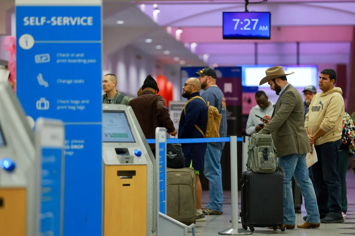 Passengers queue at El Paso International Airport after the U.S. Federal Aviation Administration lifted its temporary closure of the airspace over El Paso, saying all flights will resume as normal and that there was no threat to commercial aviation, in El Paso, Texas, U.S., February 11, 2026. REUTERS/Jose Luis Gonzalez